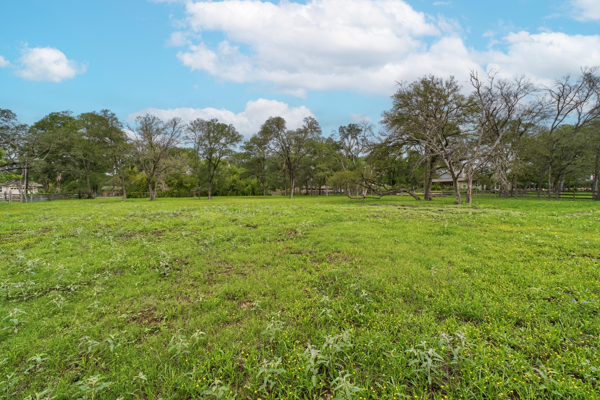 7 Pillow Road Sunset Valley, TX 78745 - Photo 10 of 22 a view of a green field with wooden fence