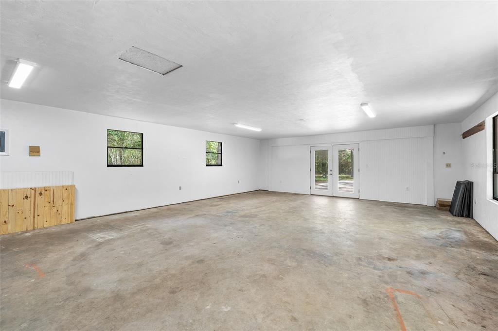 4703 Northwest 124th Street Gainesville, FL 32606 - Photo 46 of 55 an empty room with windows