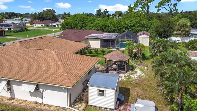 a aerial view of a house with a yard
