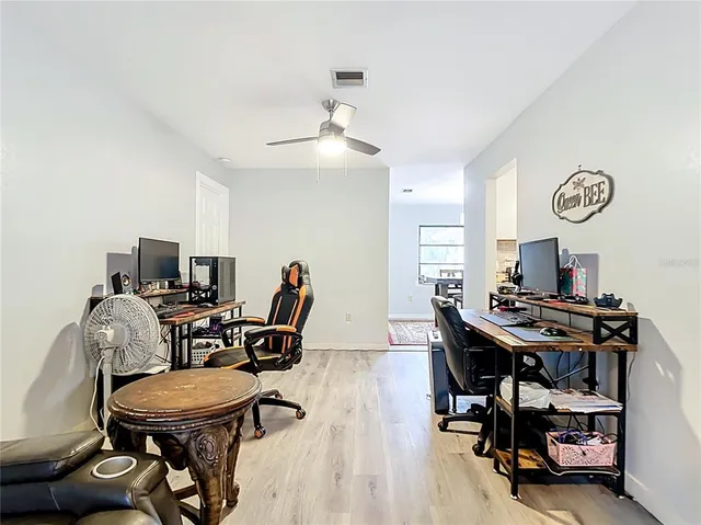 a view of a workspace with furniture