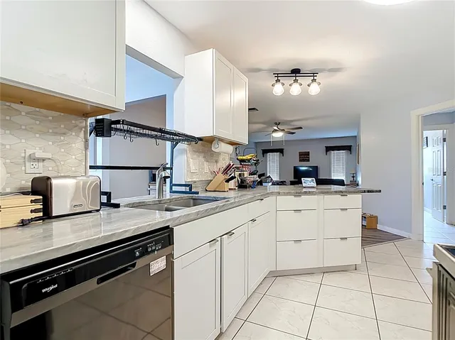 a kitchen with a sink and cabinets