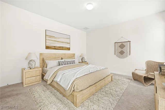 a bedroom with a bed and a couch