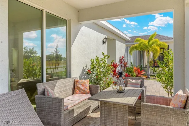 a outdoor view with a sitting space garden and furniture