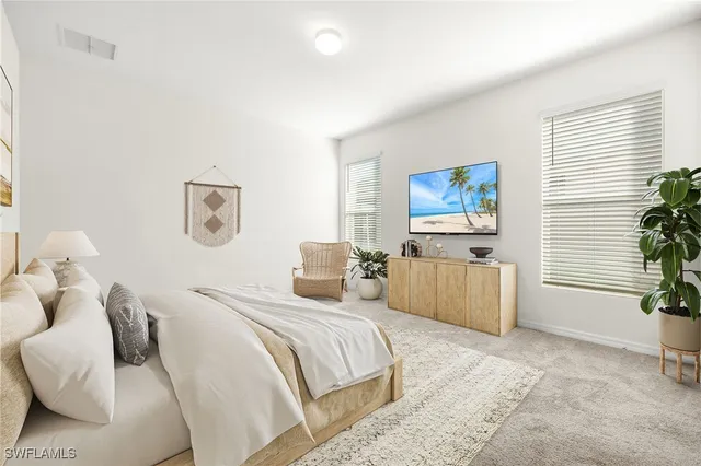 a bedroom with a bed and a couch