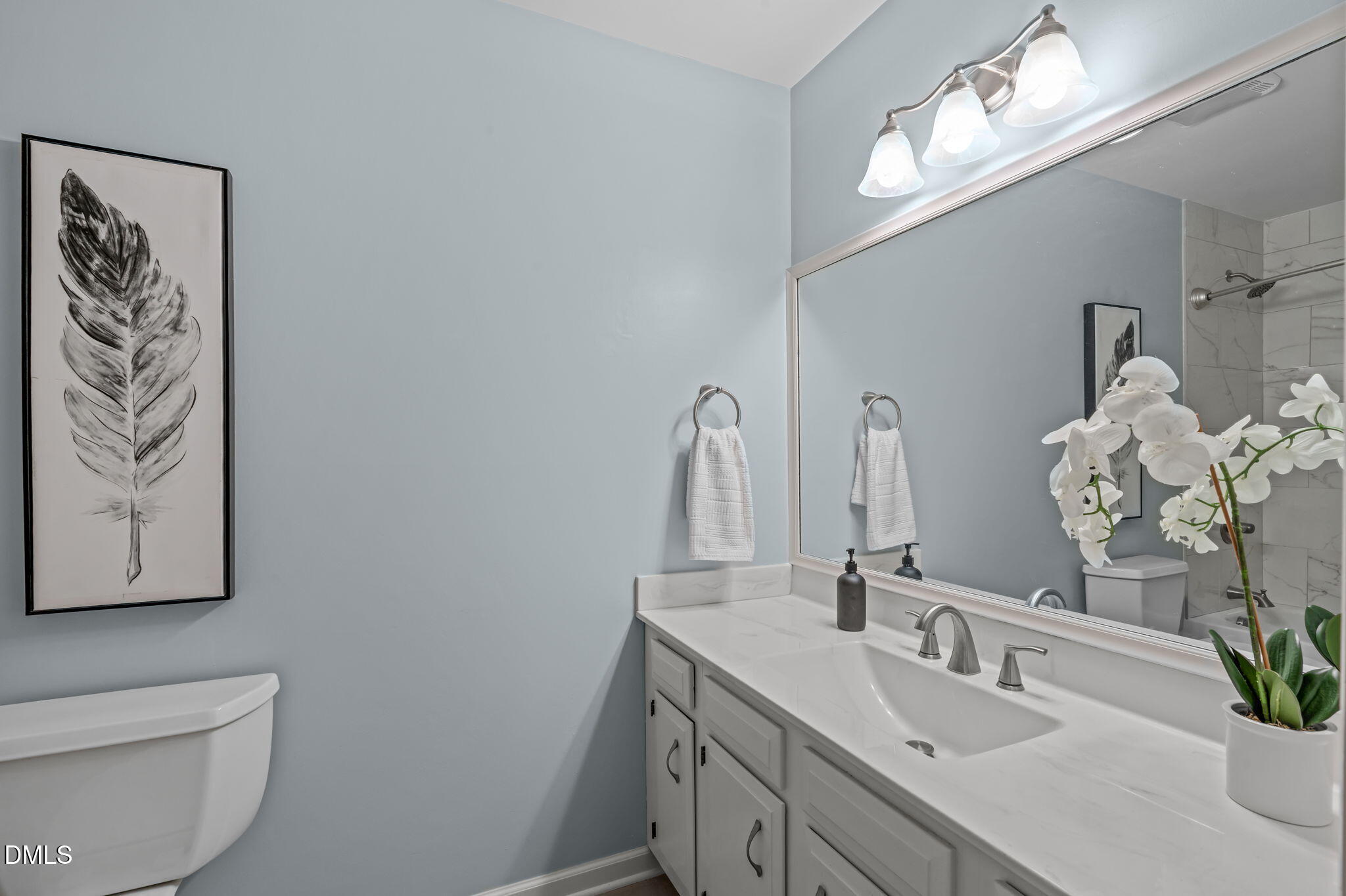 3304 Wade Avenue Raleigh, NC 27607 - Photo 23 of 38 a bathroom with a sink and a mirror