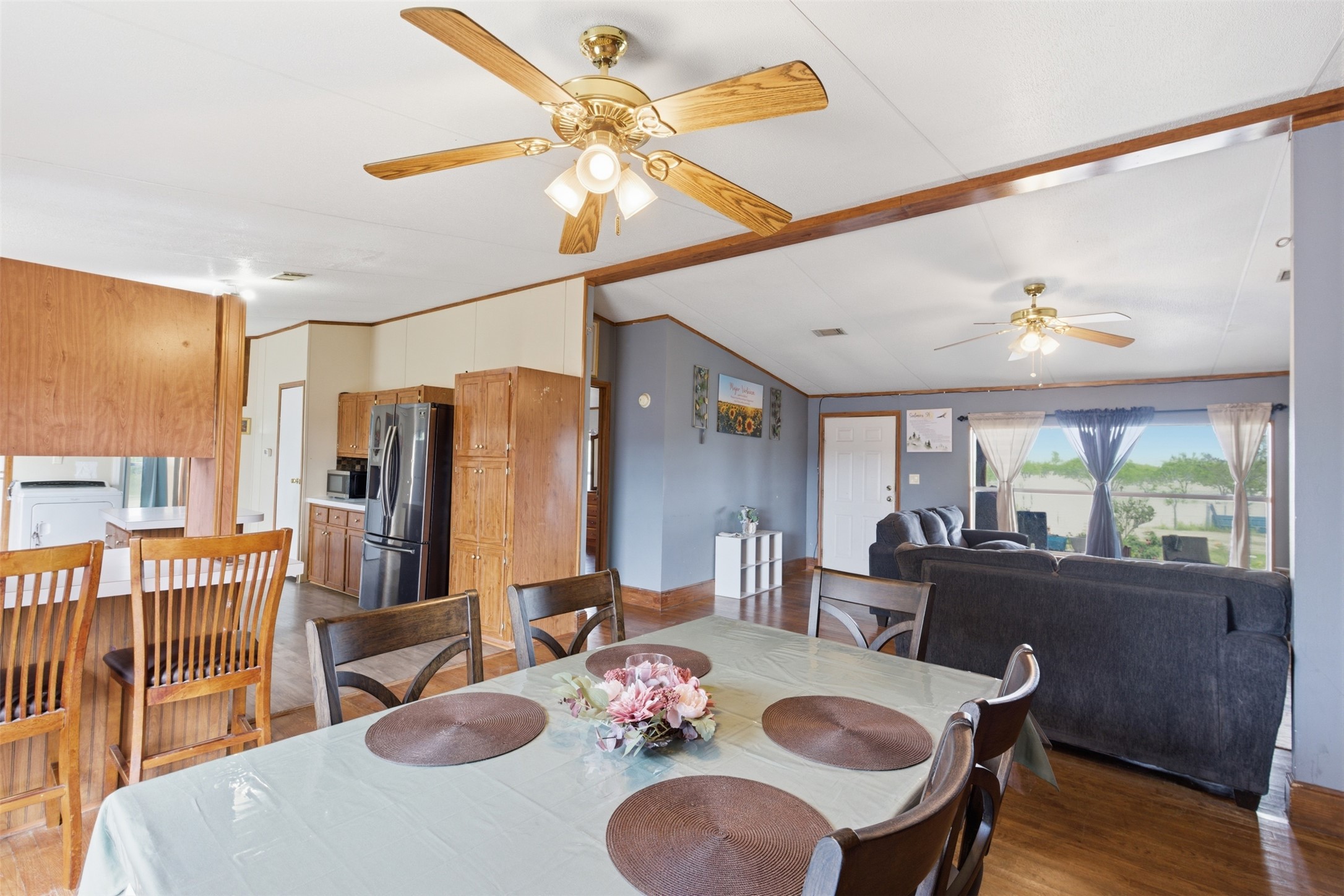1150 Walter Hoffman Road Cedar Creek, TX 78612 - Photo 15 of 25 Dining area with light wood finished floors, a ceiling fan, and vaulted ceiling
