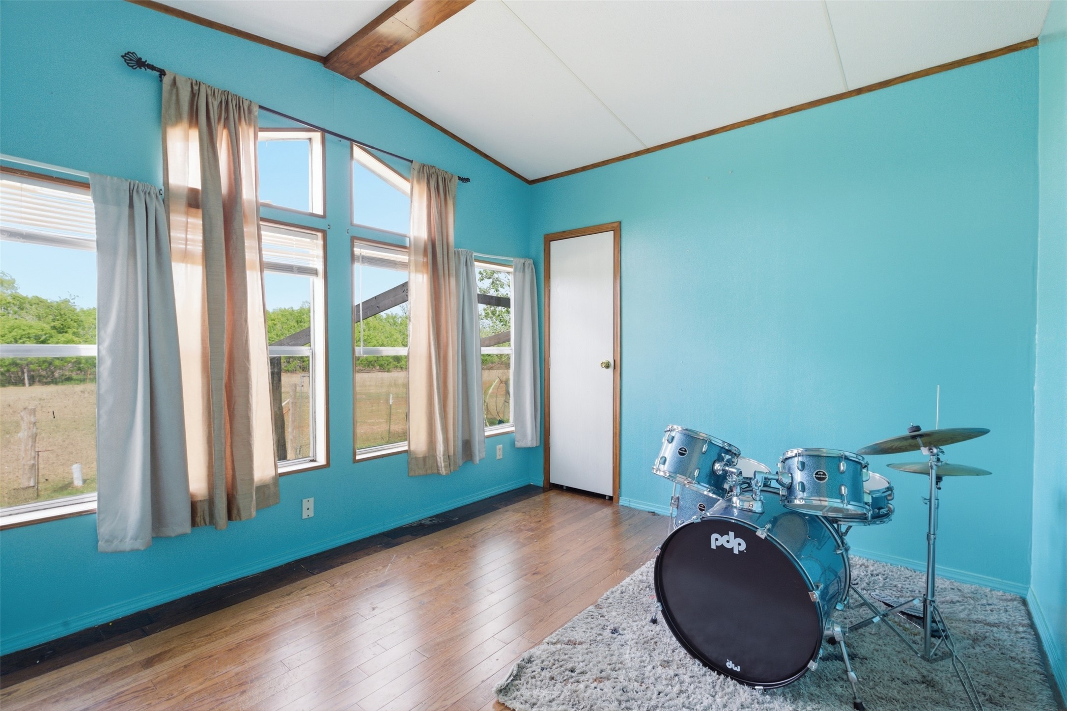 1150 Walter Hoffman Road Cedar Creek, TX 78612 - Photo 23 of 25 Rec room with hardwood / wood-style flooring and beam ceiling