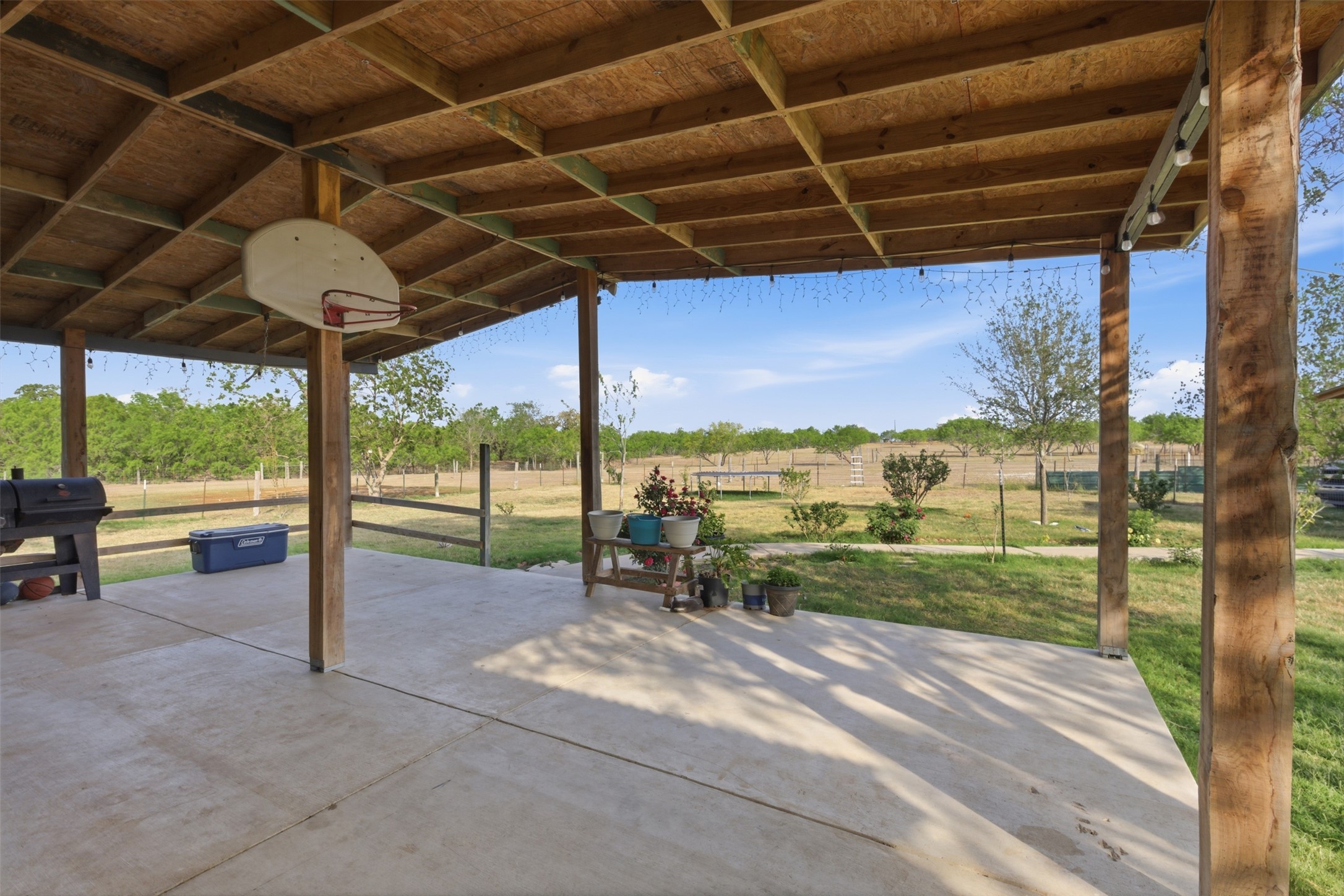 1150 Walter Hoffman Road Cedar Creek, TX 78612 - Photo 5 of 25 View of patio with a grill and a view of countryside