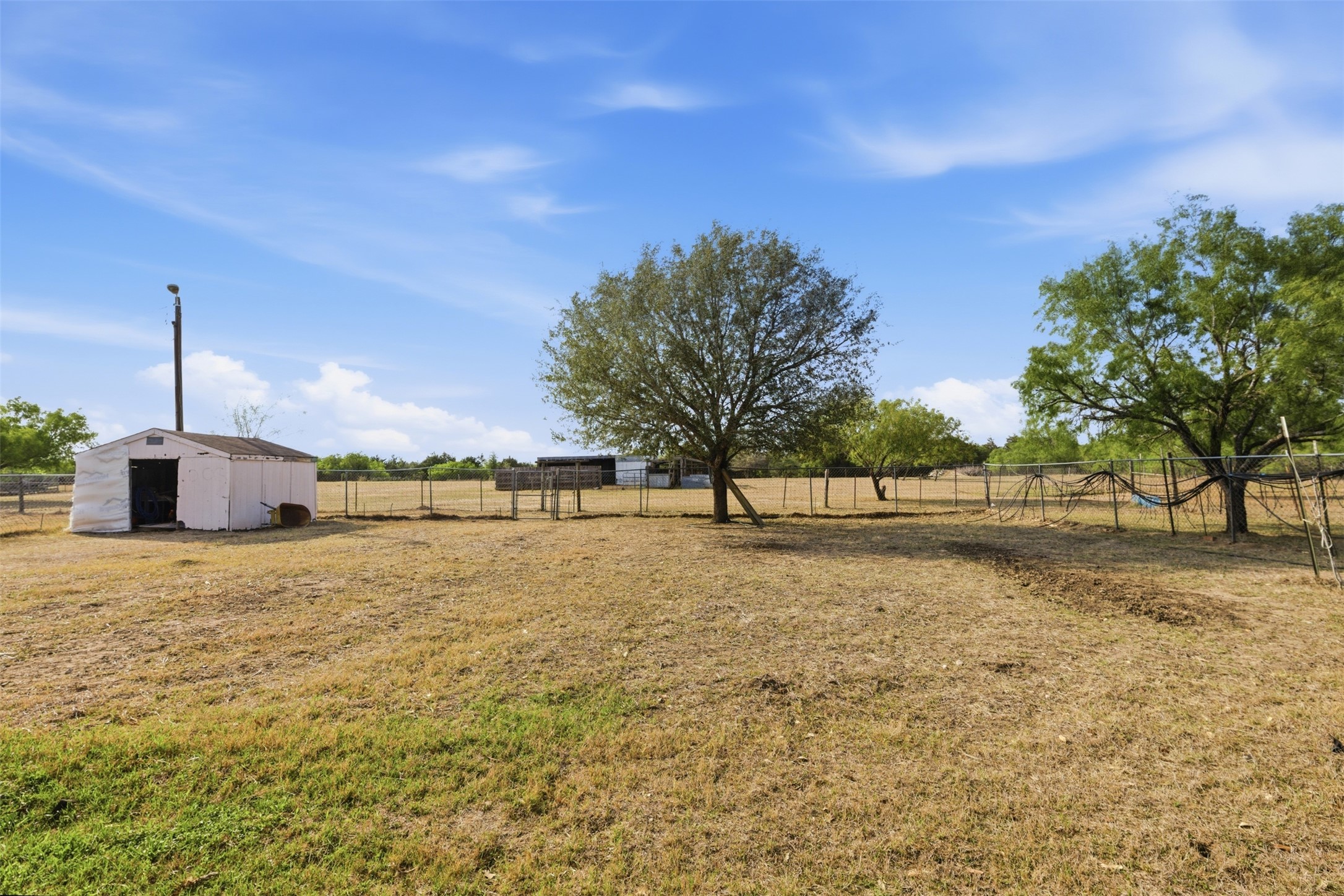 1150 Walter Hoffman Road Cedar Creek, TX 78612 - Photo 8 of 25 View of yard with an outbuilding and a rural view