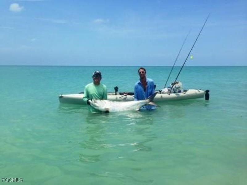 1248 Crystal Street Lehigh Acres, FL 33974 - Photo 6 of 6 a view of a patio with dining table and chairs
