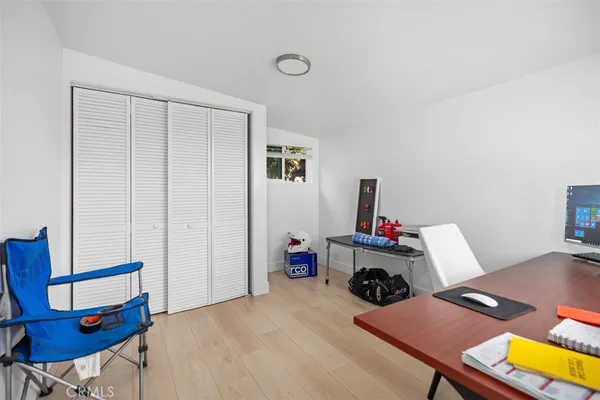 a room with furniture and wooden floor