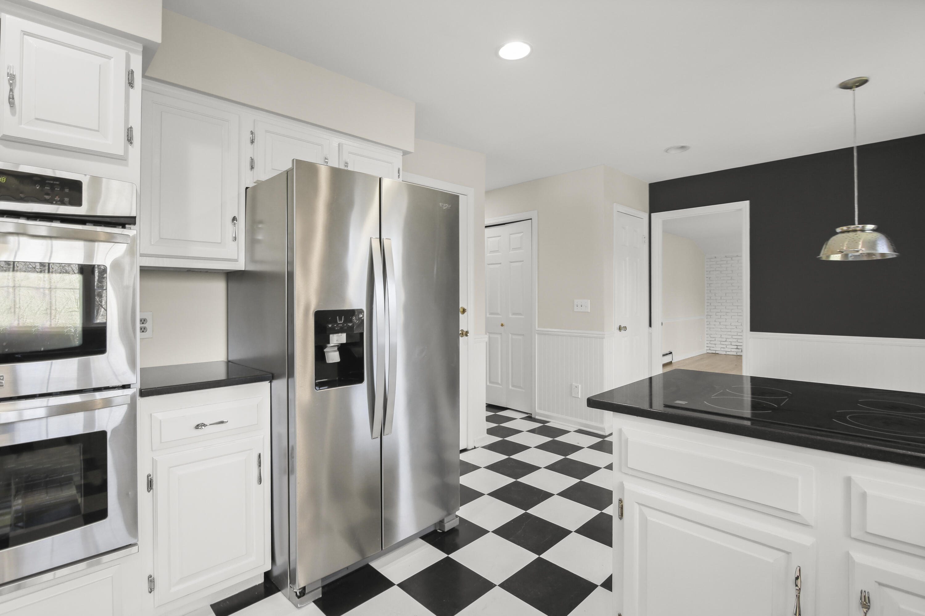 5 Barringer Road Darien, CT 06820 - Photo 12 of 39 a kitchen with a refrigerator and a stove