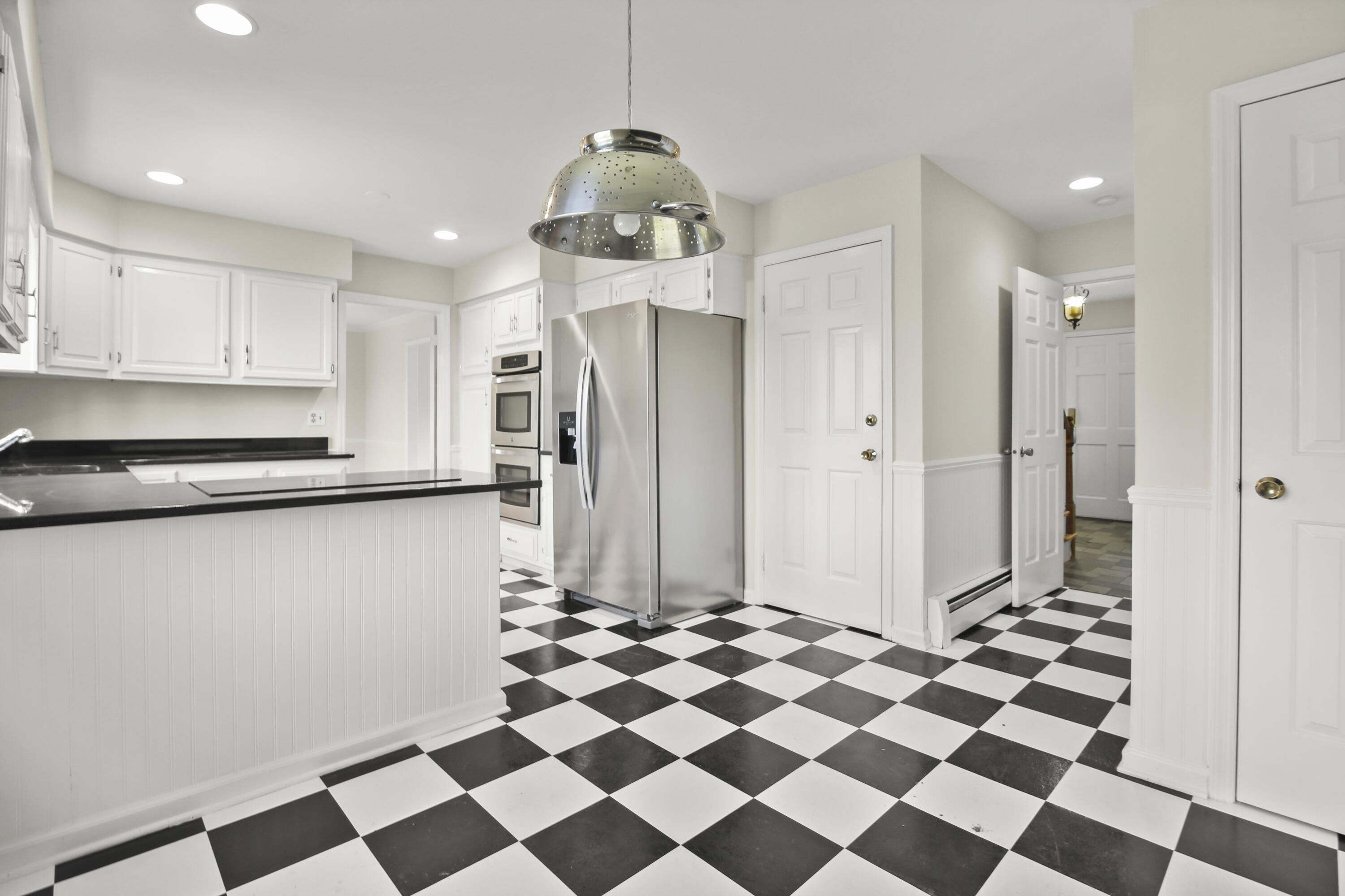 5 Barringer Road Darien, CT 06820 - Photo 13 of 39 a kitchen with stainless steel appliances a refrigerator and cabinets