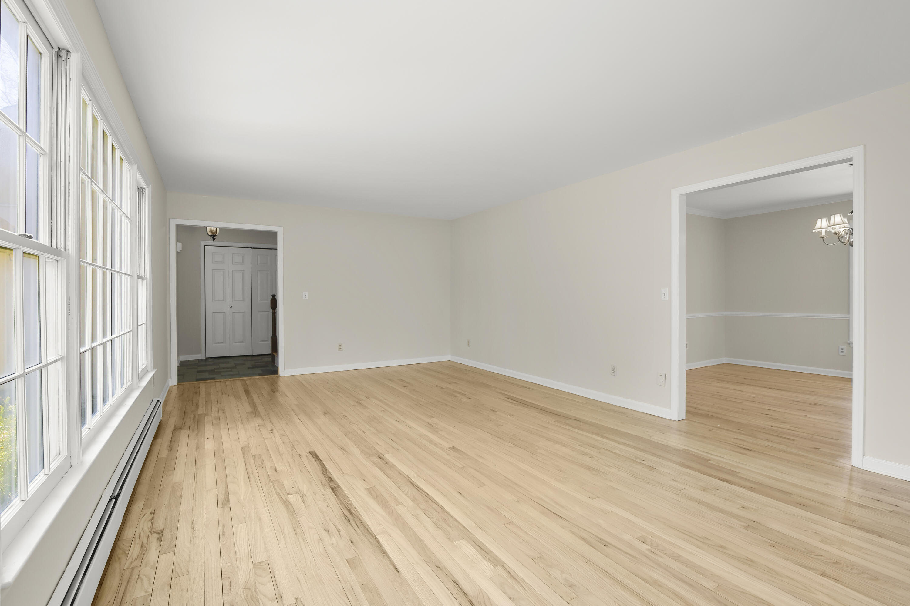 5 Barringer Road Darien, CT 06820 - Photo 17 of 39 a view of an empty room with wooden floor and a window