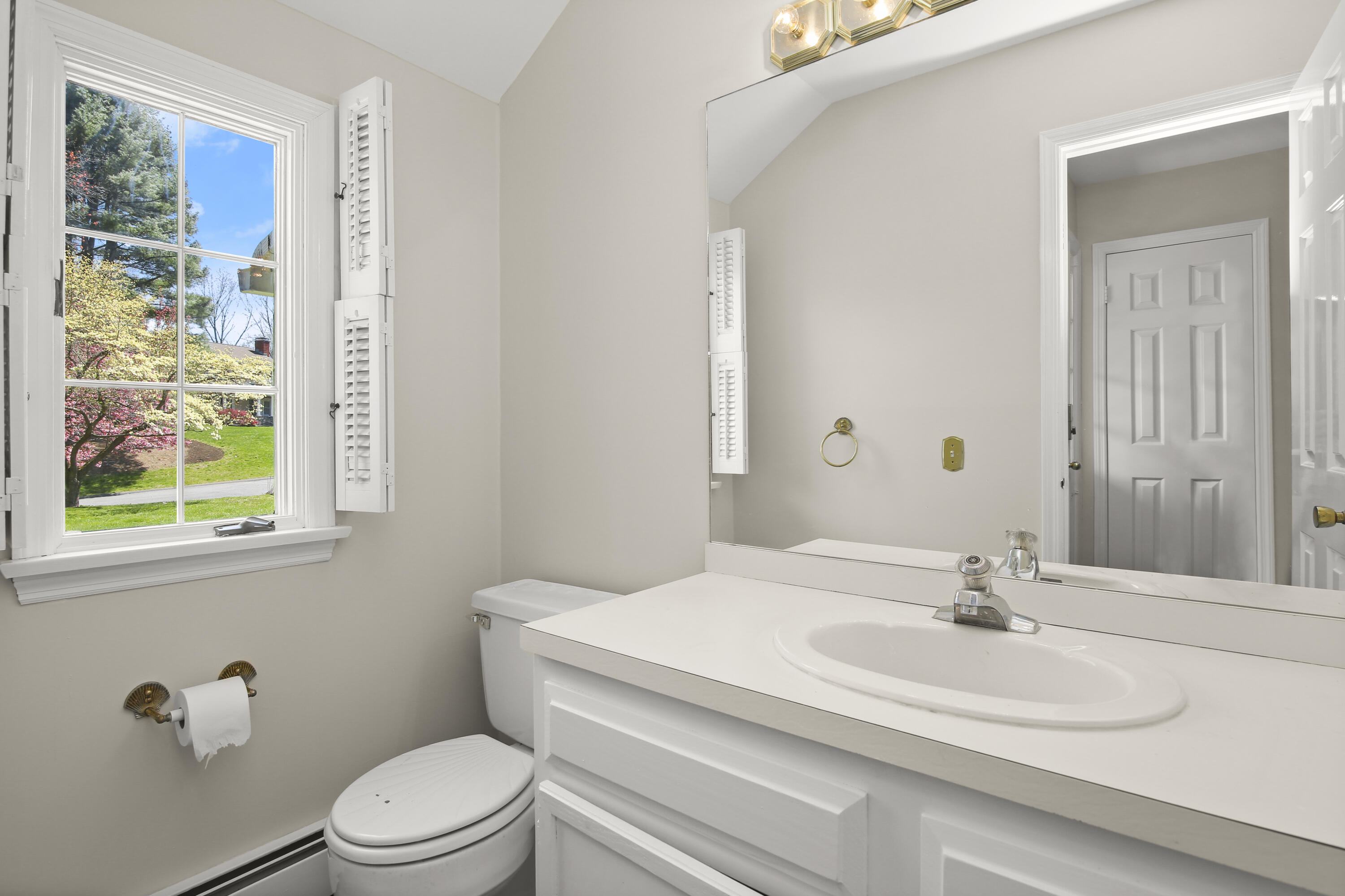 5 Barringer Road Darien, CT 06820 - Photo 19 of 39 a bathroom with a sink toilet a mirror and shower