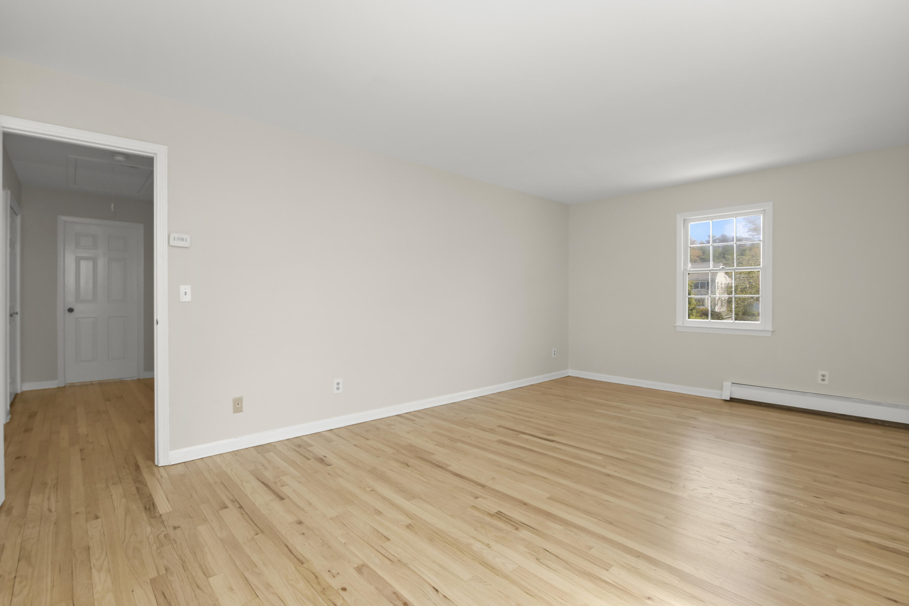 5 Barringer Road Darien, CT 06820 - Photo 26 of 39 an empty room with wooden floor and windows