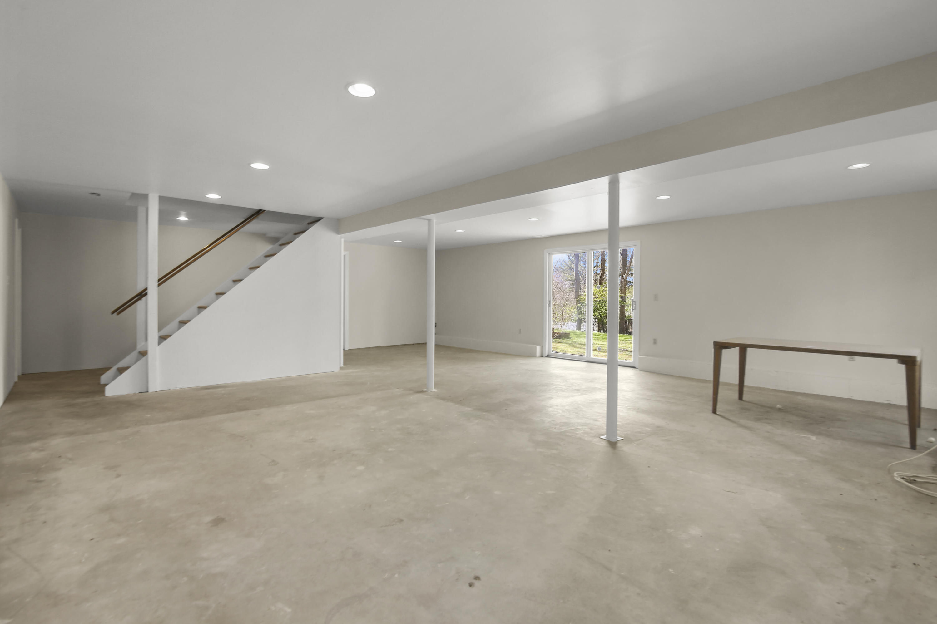 5 Barringer Road Darien, CT 06820 - Photo 29 of 39 an empty room with windows and pillars in it