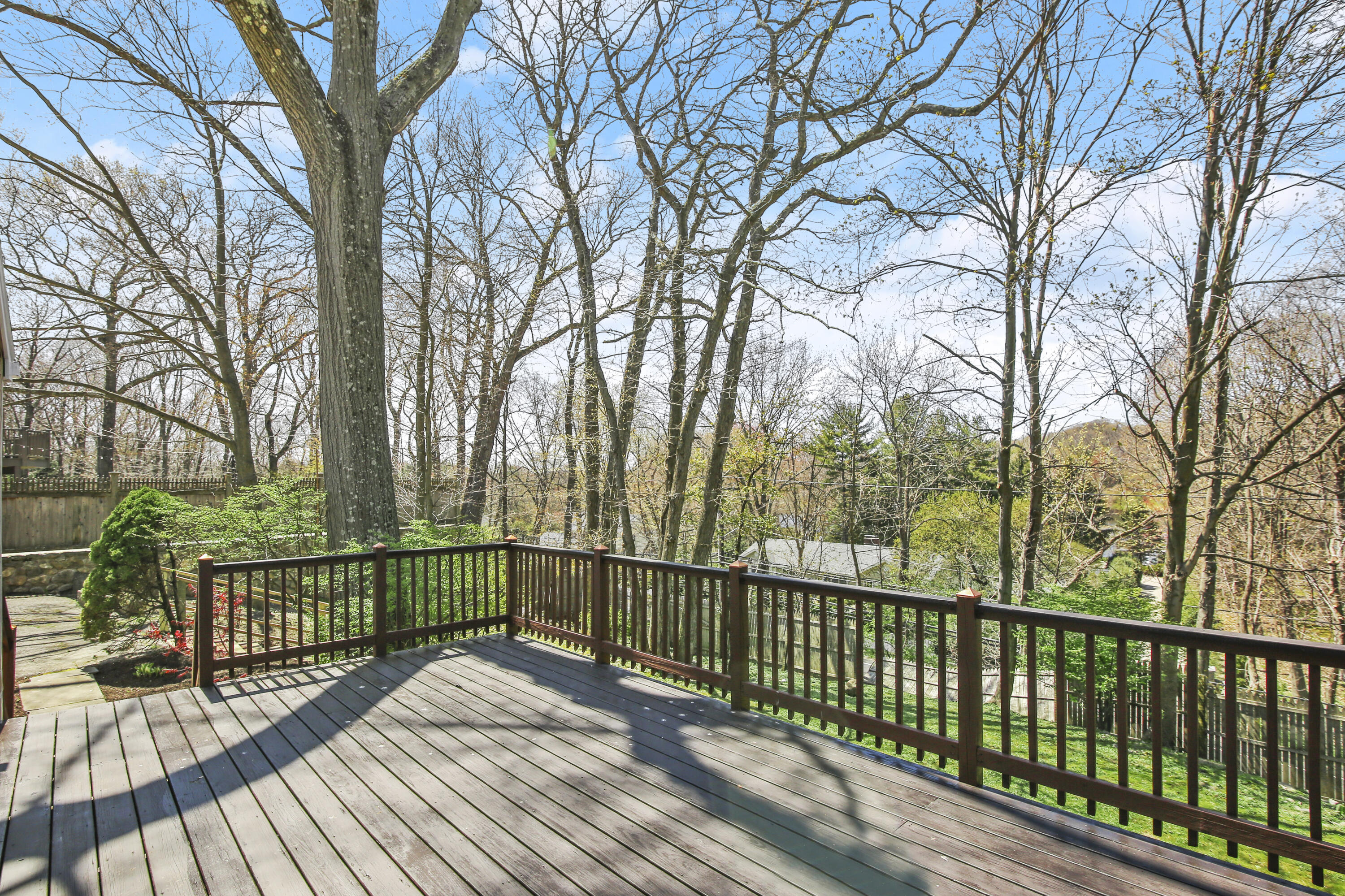 5 Barringer Road Darien, CT 06820 - Photo 32 of 39 a view of a balcony with wooden floor and fence