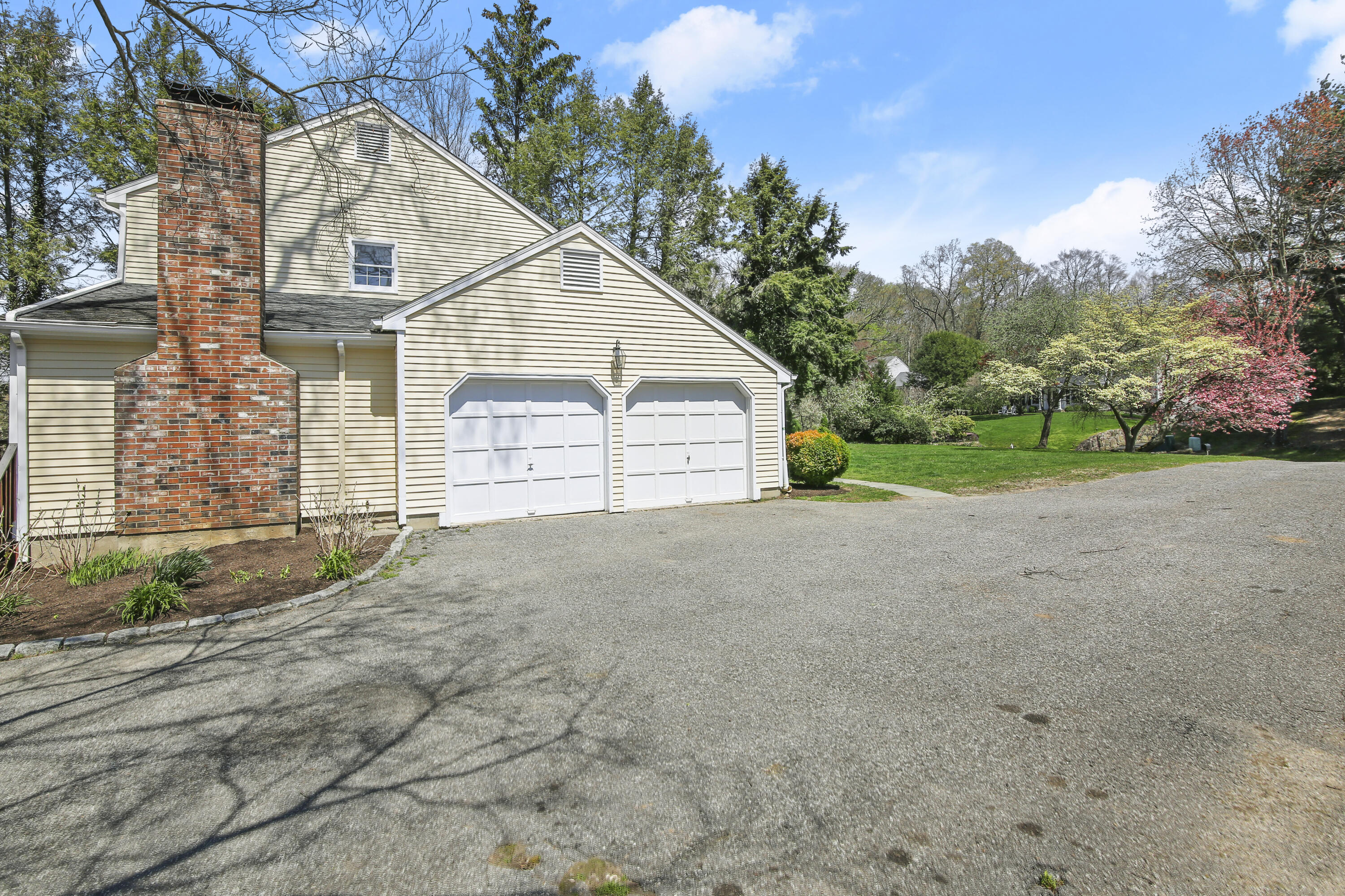 5 Barringer Road Darien, CT 06820 - Photo 34 of 39 a view of a house with a yard and garage