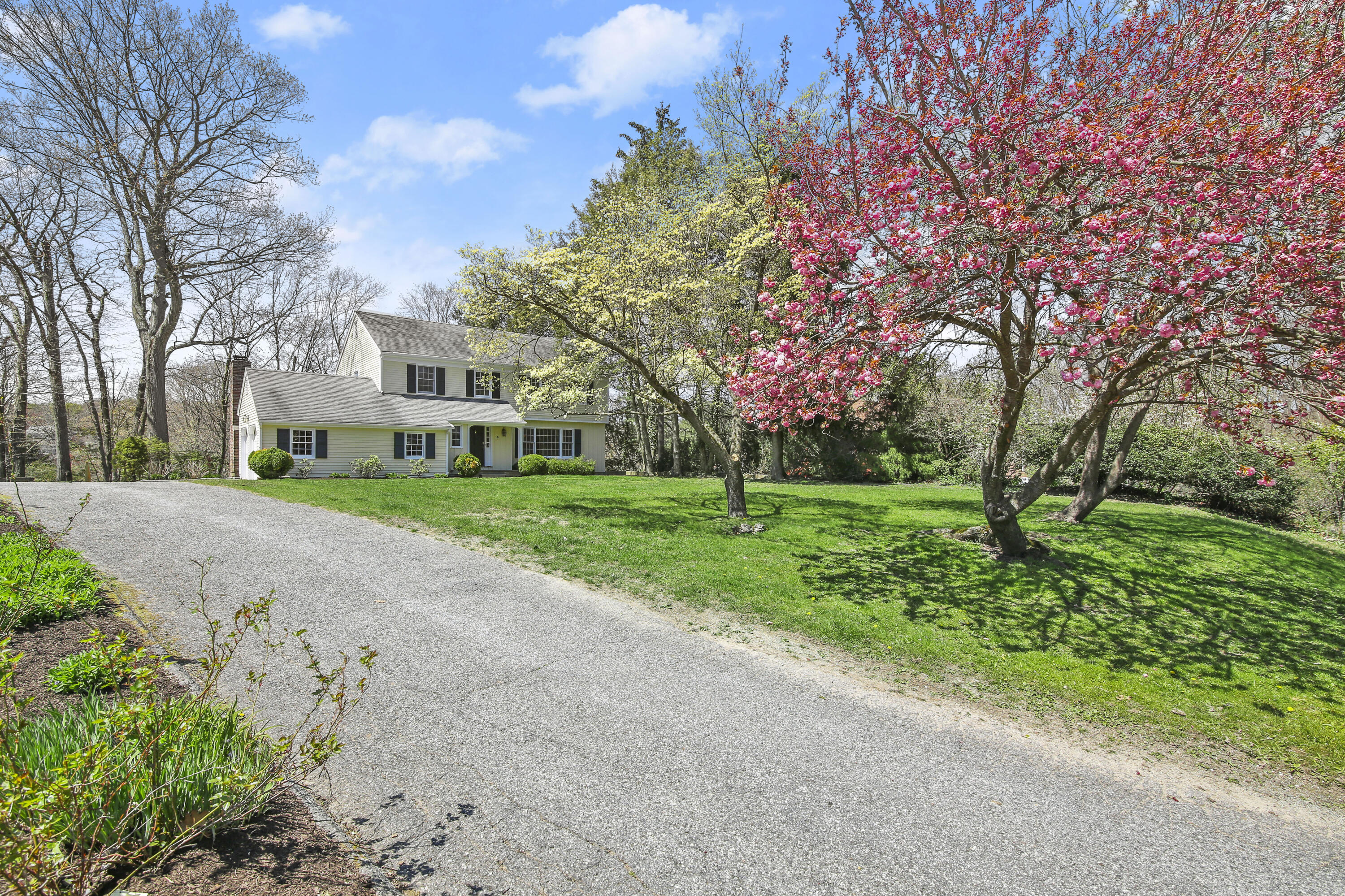 5 Barringer Road Darien, CT 06820 - Photo 35 of 39 a view of a house with a big yard and large trees