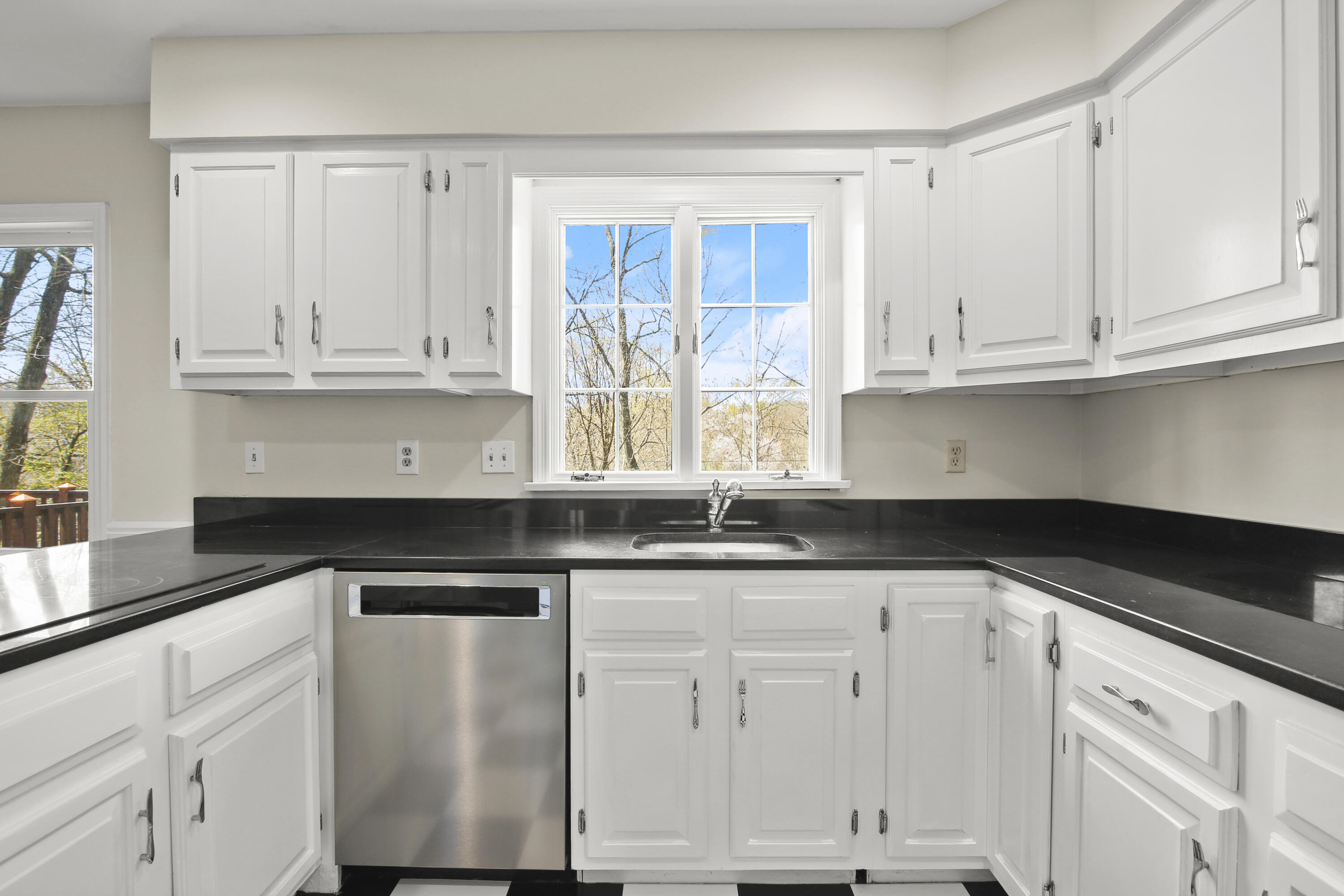 5 Barringer Road Darien, CT 06820 - Photo 8 of 39 a kitchen with granite countertop white cabinets and a sink