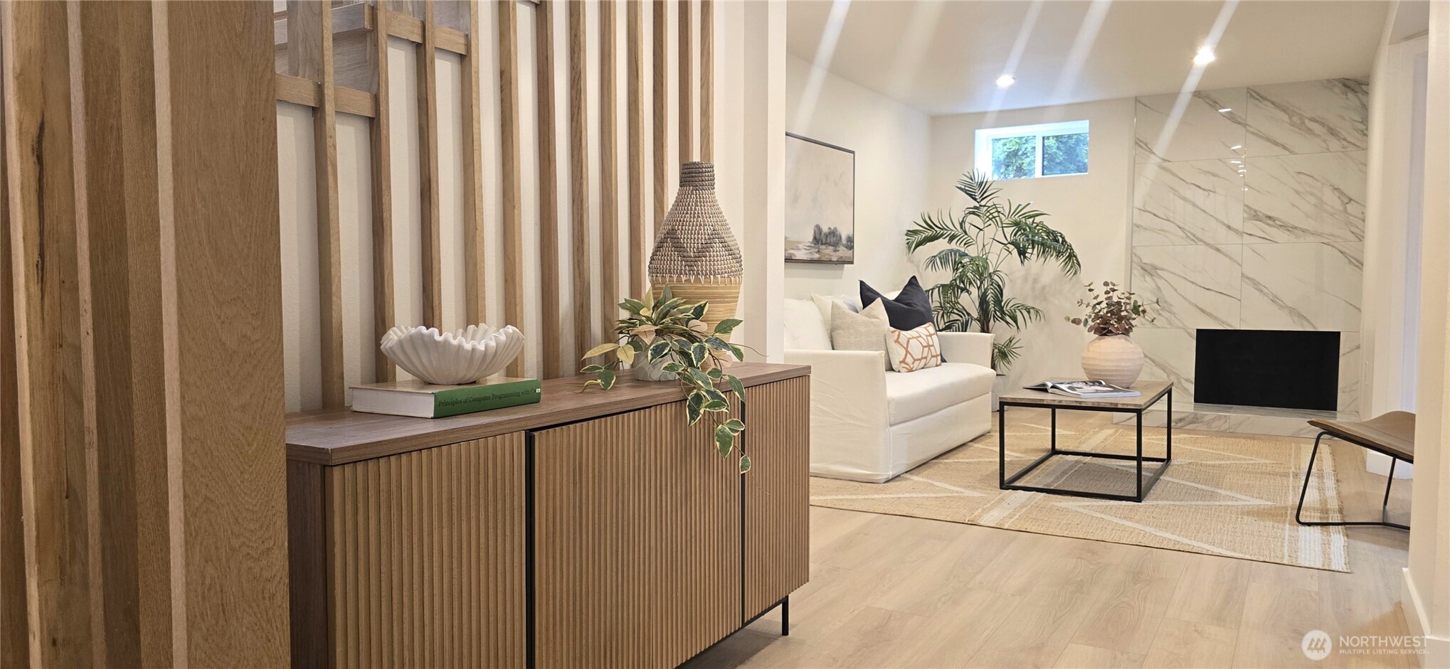 8421 39th Avenue Southwest Seattle, WA 98136 - Photo 13 of 24 a living room with furniture and a potted plant
