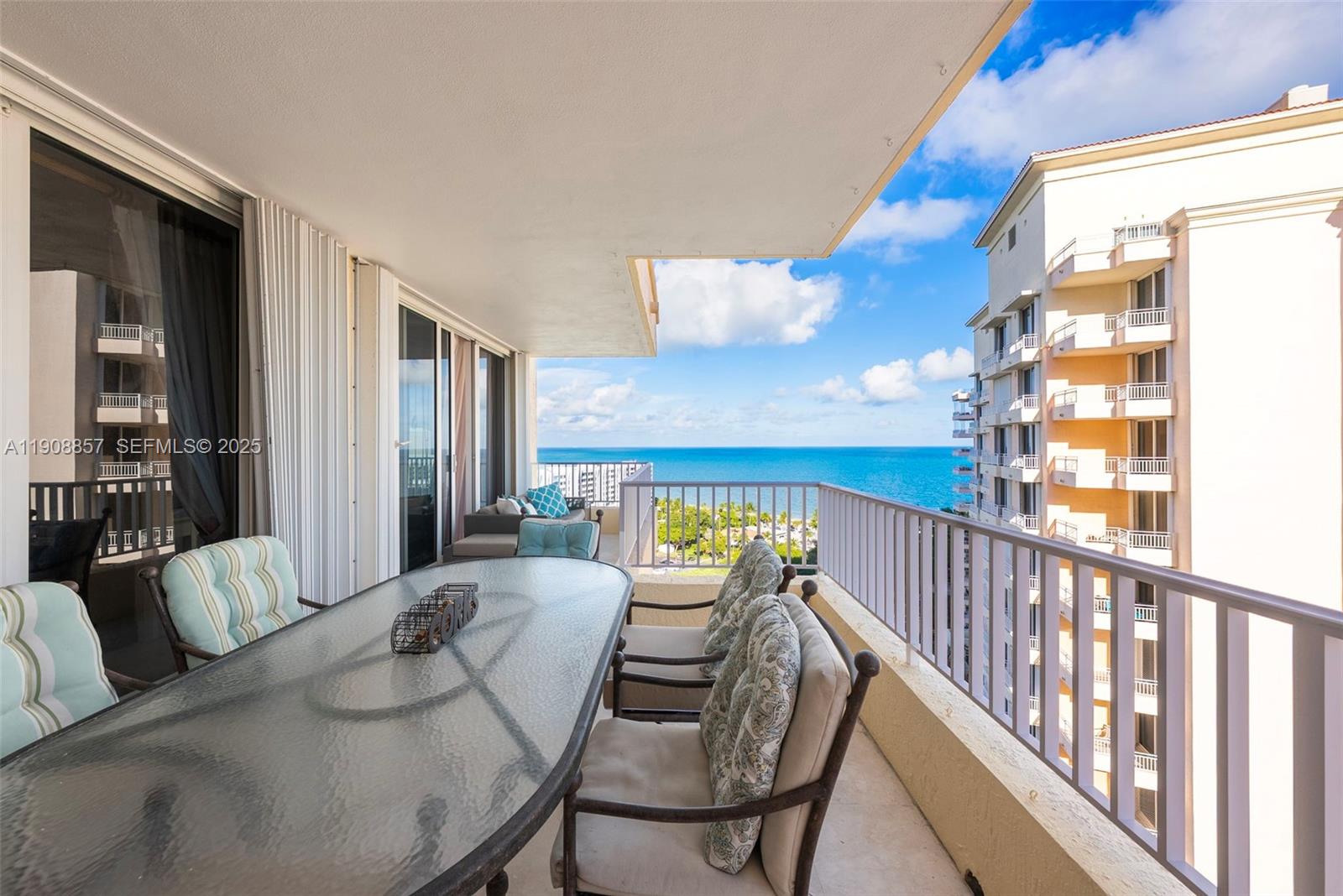 781 Crandon Boulevard, Unit 1406 Key Biscayne, FL 33149 - Photo 11 of 47 a view of a dining room with furniture window and wooden floor
