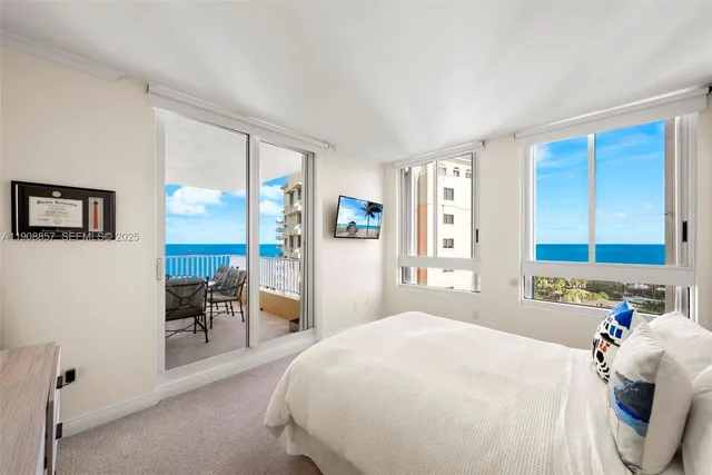 a bedroom with a large bed and a large window