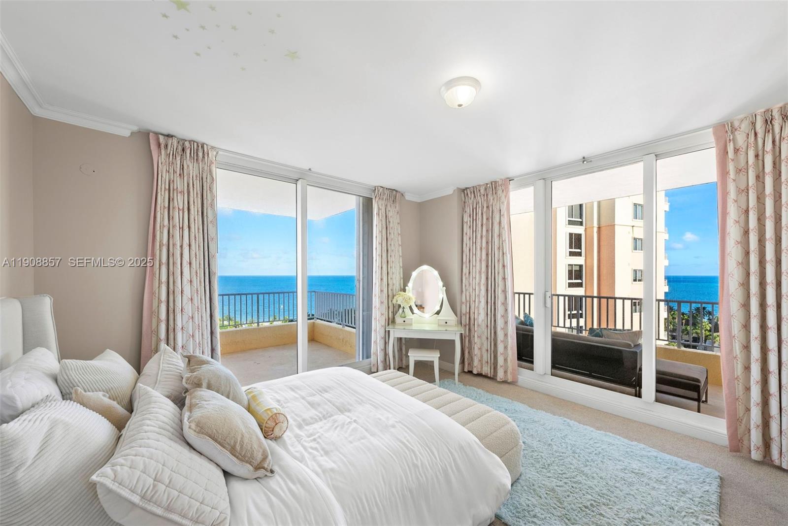 781 Crandon Boulevard, Unit 1406 Key Biscayne, FL 33149 - Photo 18 of 47 a bedroom with a bed and a large window