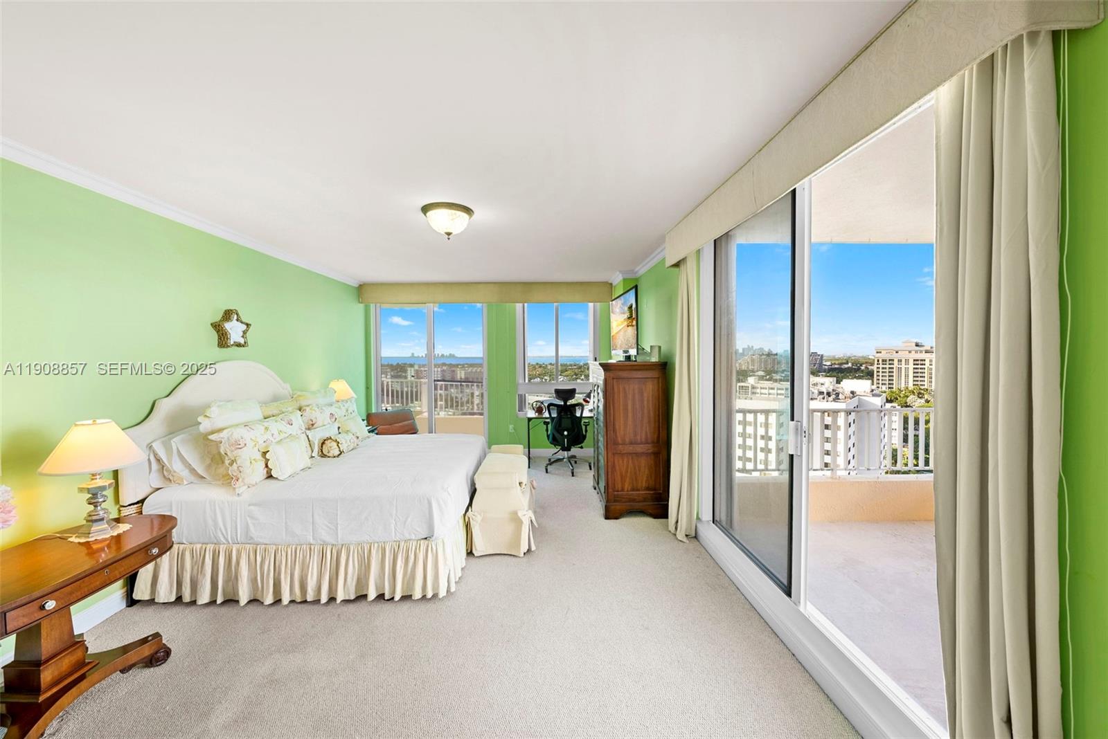 781 Crandon Boulevard, Unit 1406 Key Biscayne, FL 33149 - Photo 23 of 47 a bedroom with a bed and large window