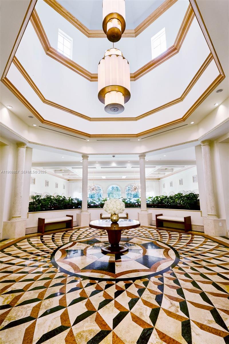 781 Crandon Boulevard, Unit 1406 Key Biscayne, FL 33149 - Photo 45 of 47 a view of a lobby with furniture and floor to ceiling window