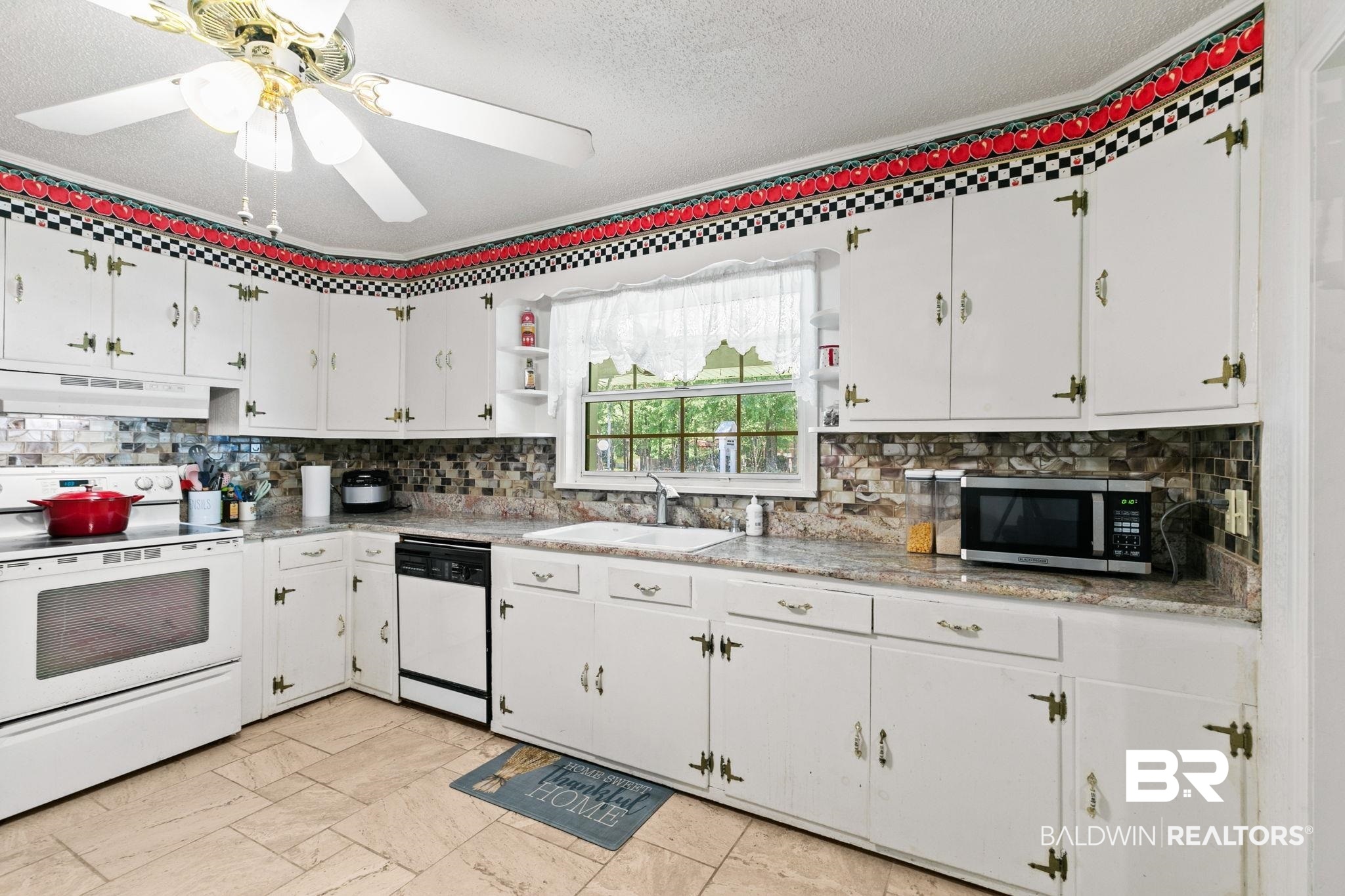 927 Cleveland Road Saraland, AL 36571 - Photo 11 of 80 Kitchen featuring abundant white cabinetry, a white electric range, a black dishwasher, a double basin sink, and wood-finish tile flooring