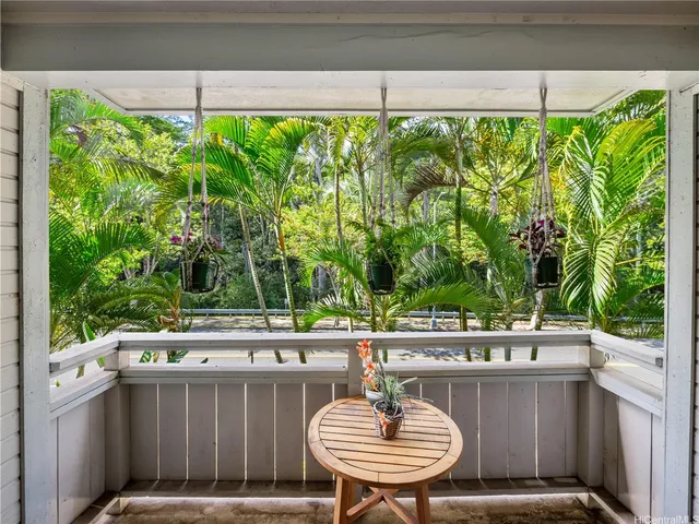 a outdoor dining space with furniture and garden view