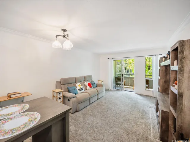 a bedroom with furniture and a flat screen tv