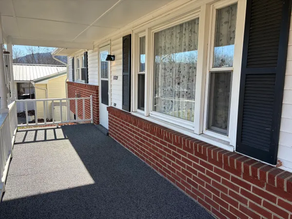 a view of a balcony with furniture