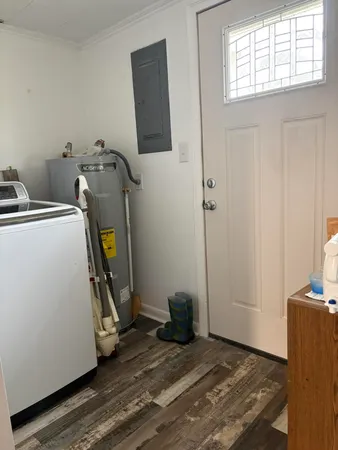 a view of a room with gym equipment and a mirror