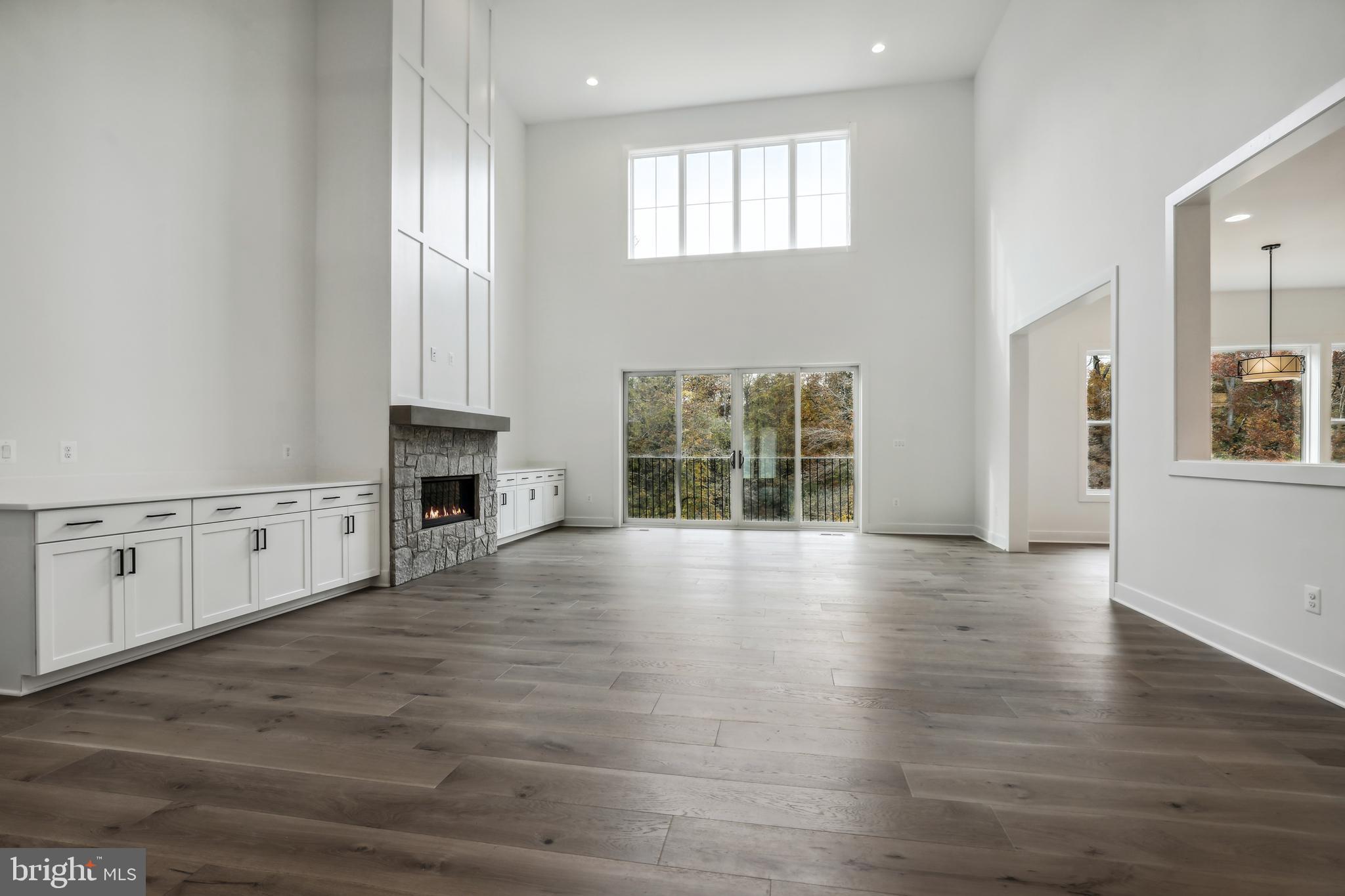 12712 High Meadow Road North Potomac, MD 20878 - Photo 3 of 14 an empty room with wooden floor and windows