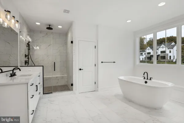 a bathroom with a bathtub and a sink