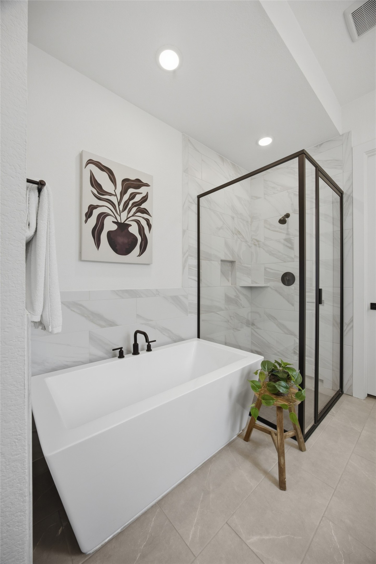 1217 Calendula Trail Georgetown, TX 78628 - Photo 13 of 39 Bathroom with a freestanding tub, tile walls, a stall shower, and recessed lighting