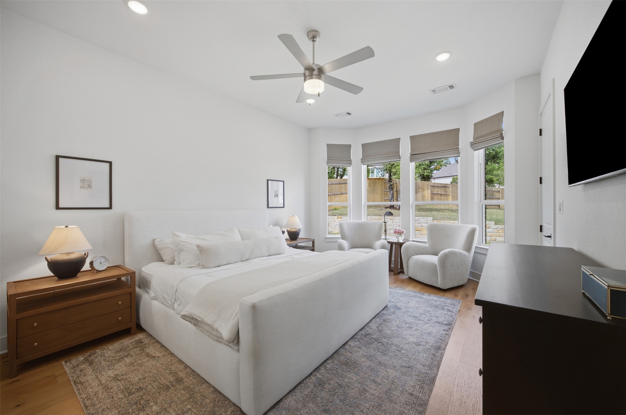 1217 Calendula Trail Georgetown, TX 78628 - Photo 14 of 39 Bedroom featuring light wood finished floors, a ceiling fan, and recessed lighting
