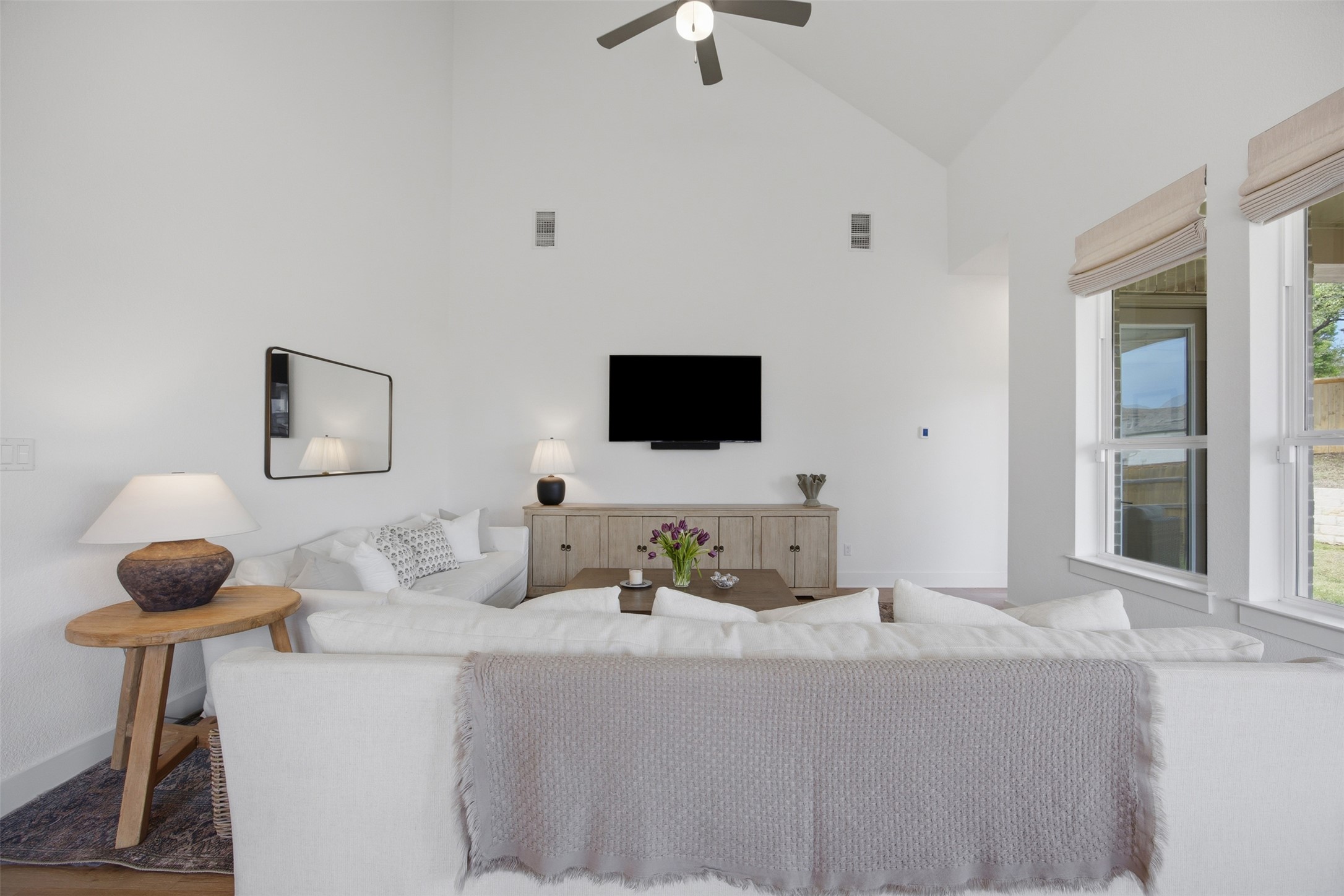 1217 Calendula Trail Georgetown, TX 78628 - Photo 16 of 39 Living area featuring lofted ceiling and a ceiling fan