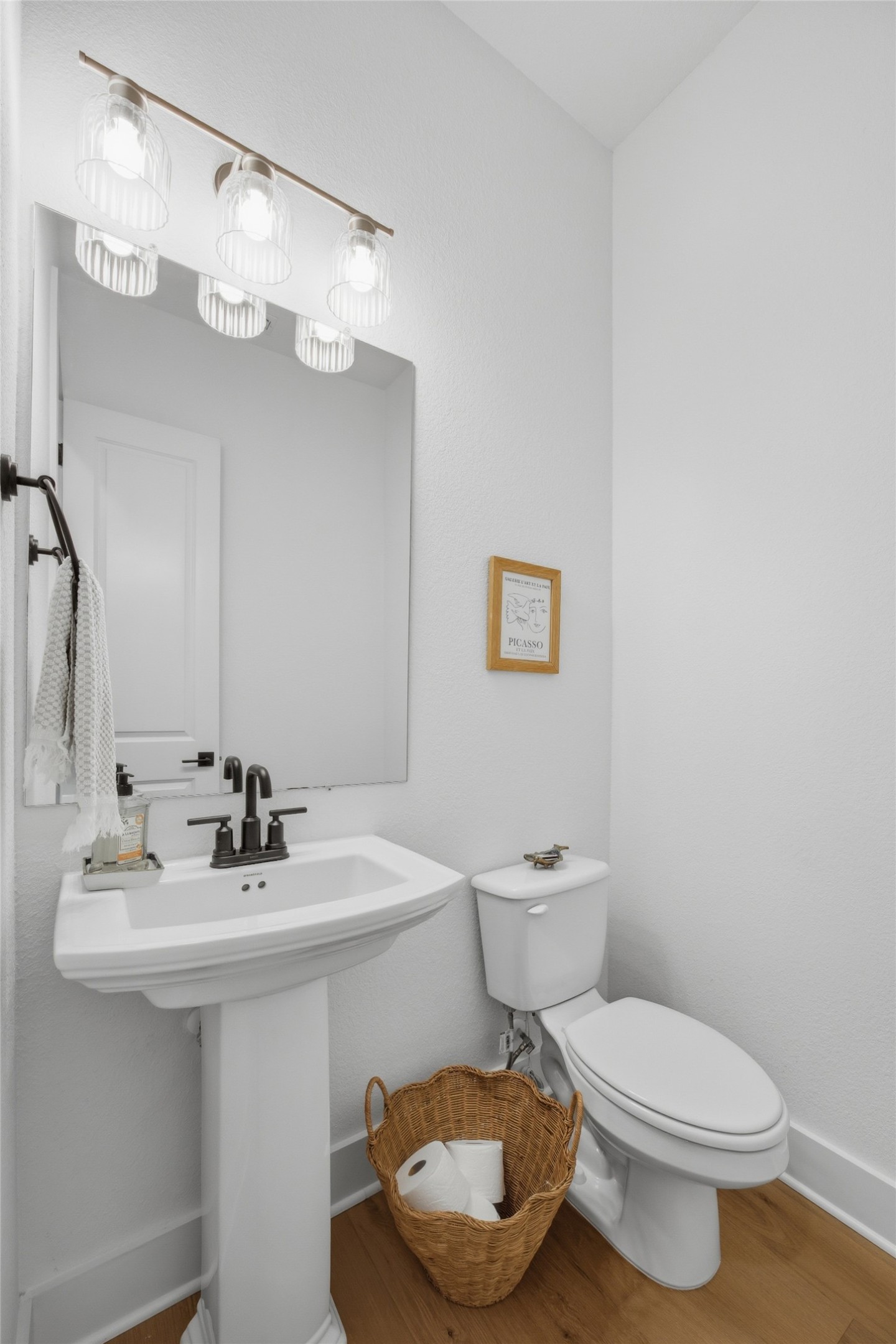 1217 Calendula Trail Georgetown, TX 78628 - Photo 22 of 39 Half bathroom with toilet and wood finished floors