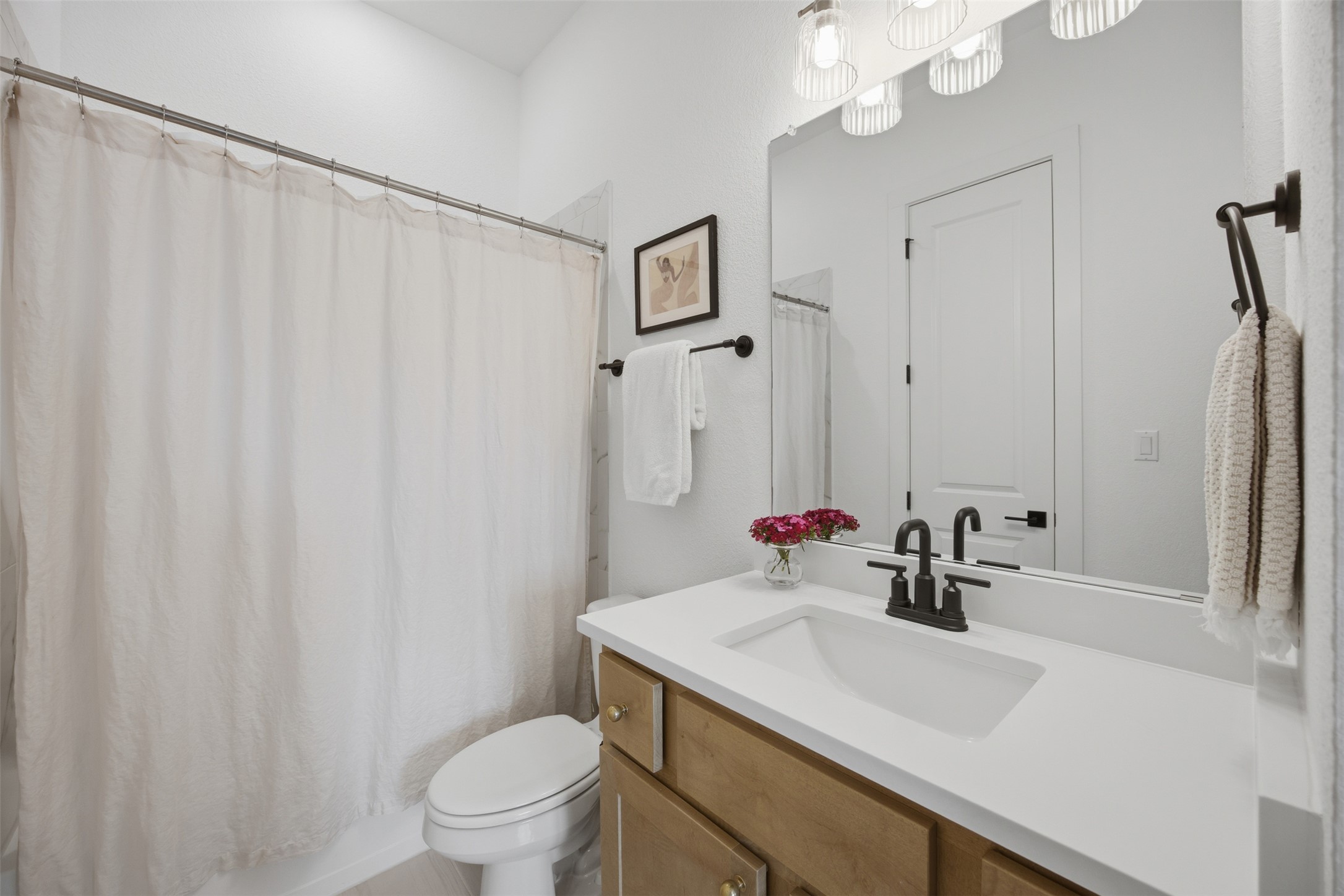 1217 Calendula Trail Georgetown, TX 78628 - Photo 24 of 39 Bathroom with vanity and shower / bath combo with shower curtain
