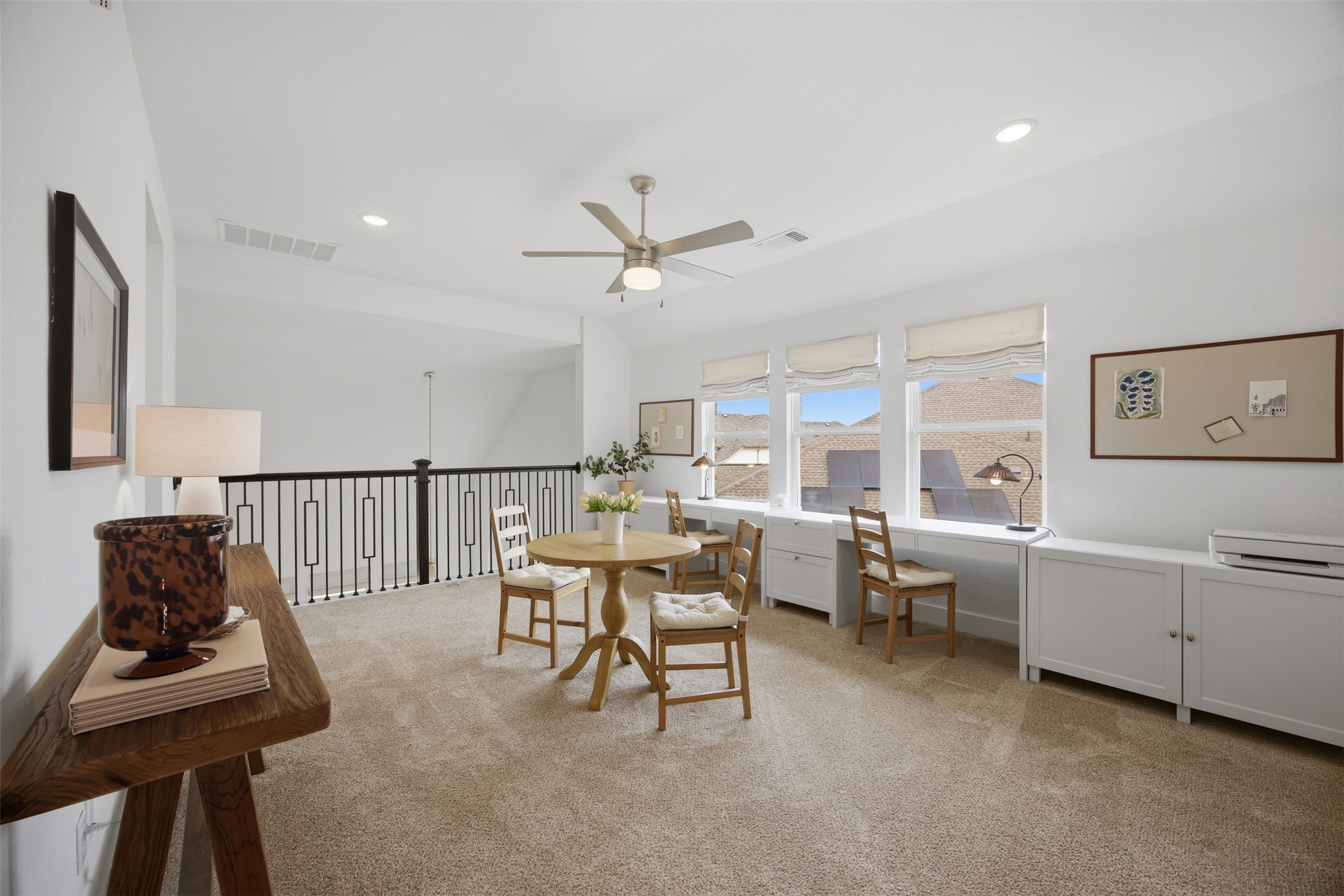1217 Calendula Trail Georgetown, TX 78628 - Photo 27 of 39 Dining room featuring a ceiling fan, light colored carpet, recessed lighting, and lofted ceiling