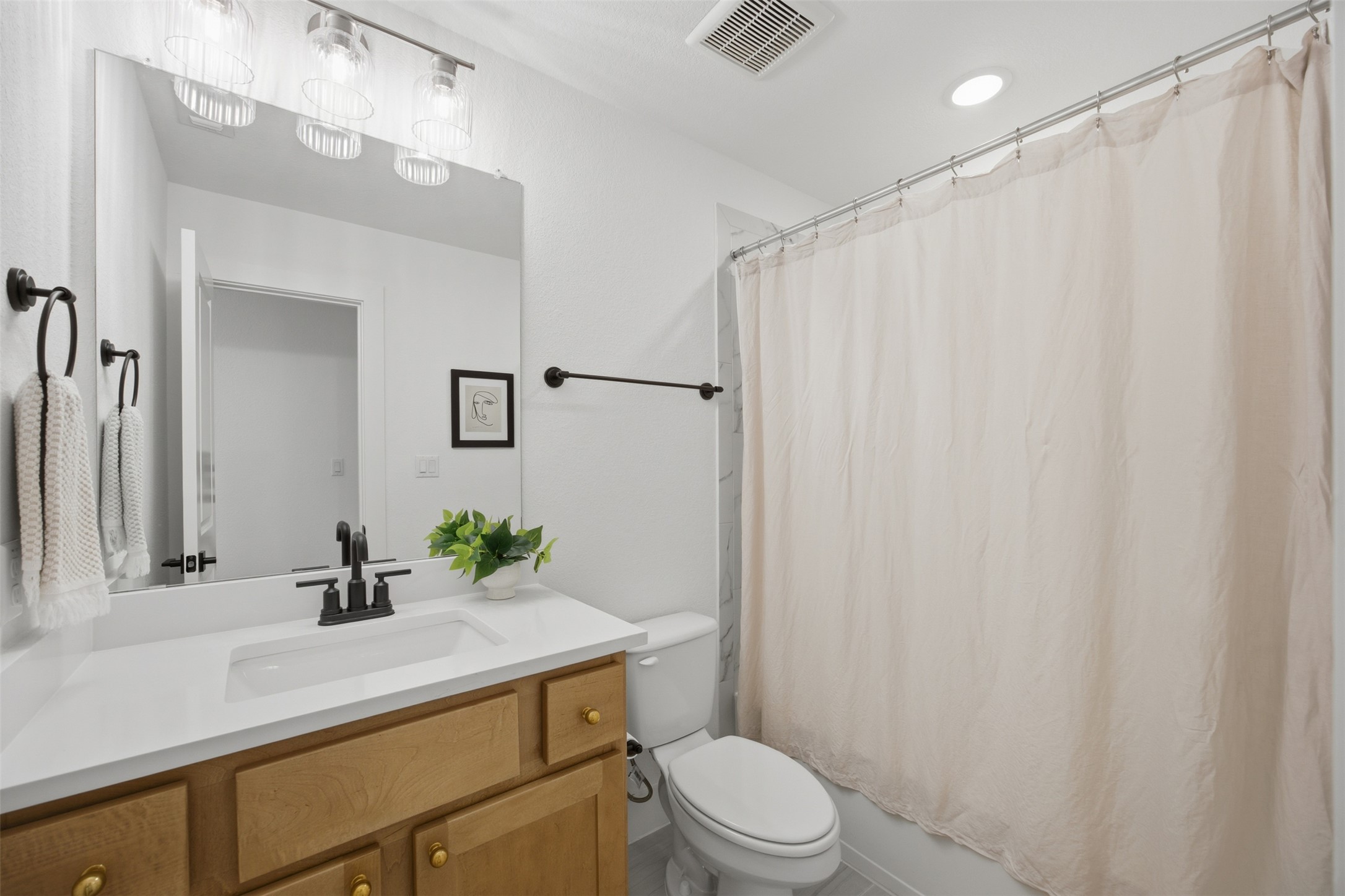 1217 Calendula Trail Georgetown, TX 78628 - Photo 30 of 39 Bathroom with vanity and shower / tub combo