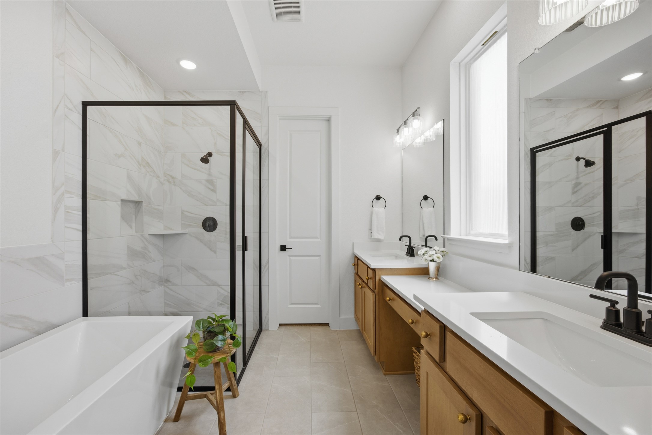 1217 Calendula Trail Georgetown, TX 78628 - Photo 9 of 39 Full bathroom featuring double vanity, a marble finish shower, a soaking tub, and recessed lighting