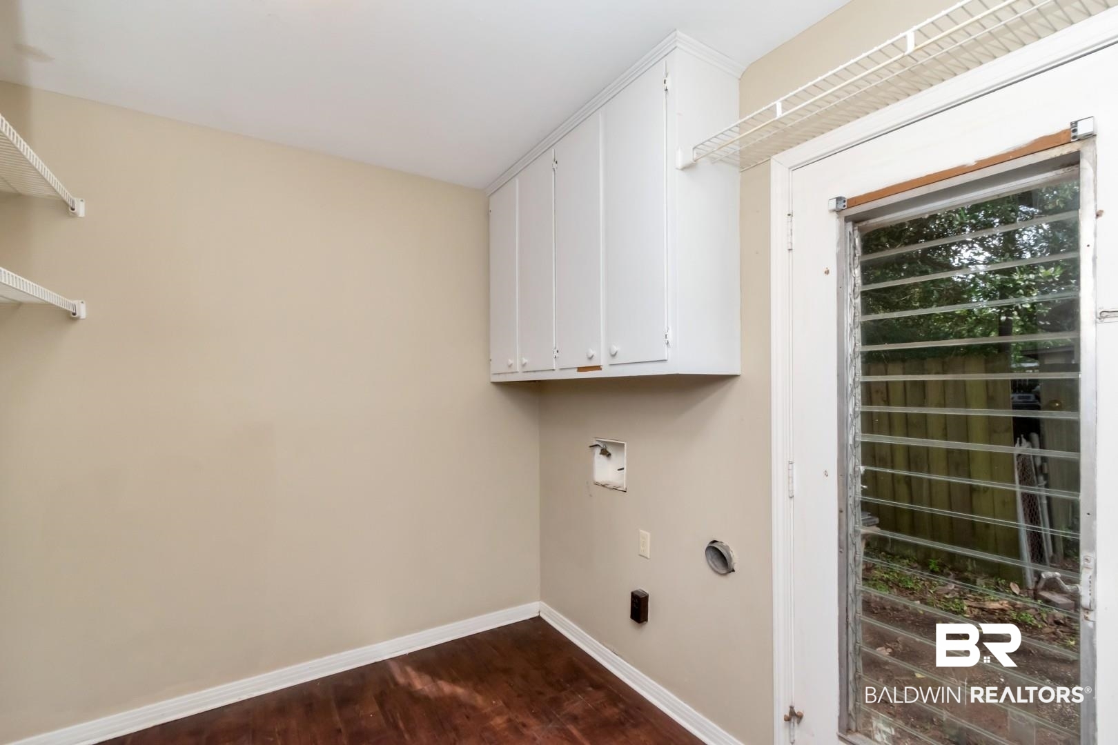 324 Judson Drive Mobile, AL 36608 - Photo 15 of 20 Laundry room with cabinet space, dark wood finished floors, and washer hookup