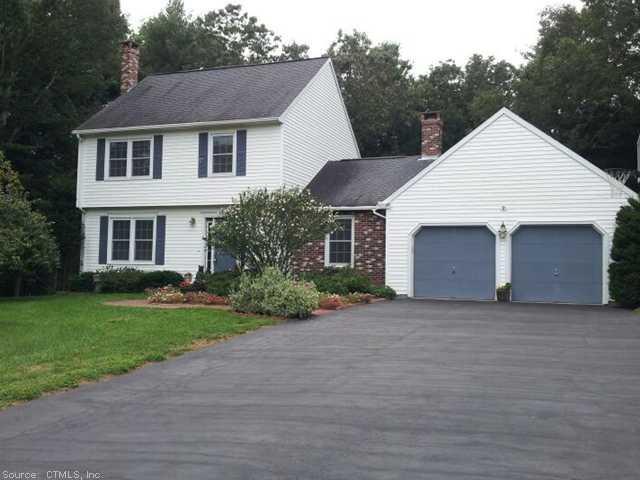 9 Stony Ridge Road Windham, CT 06256 - Photo 1 of 1 a front view of a house with a garden and garage