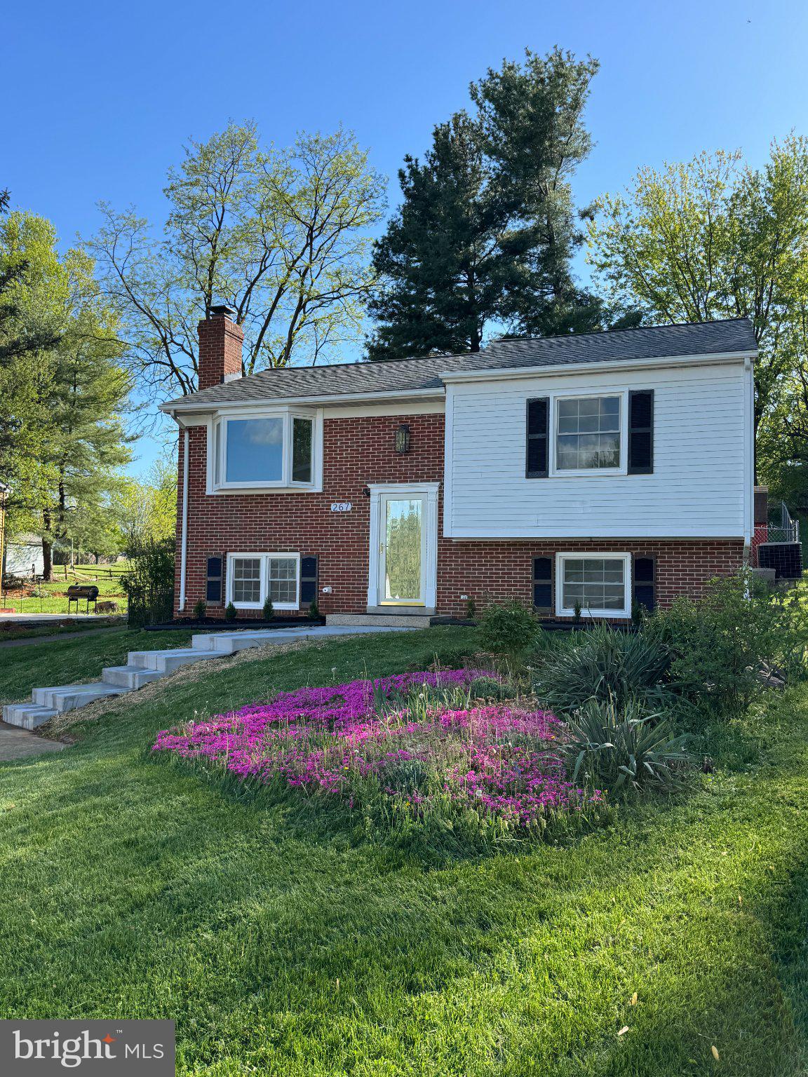 267 Longford Court Frederick, MD 21702 - Photo 2 of 29 Charming brick home with vibrant blooms.