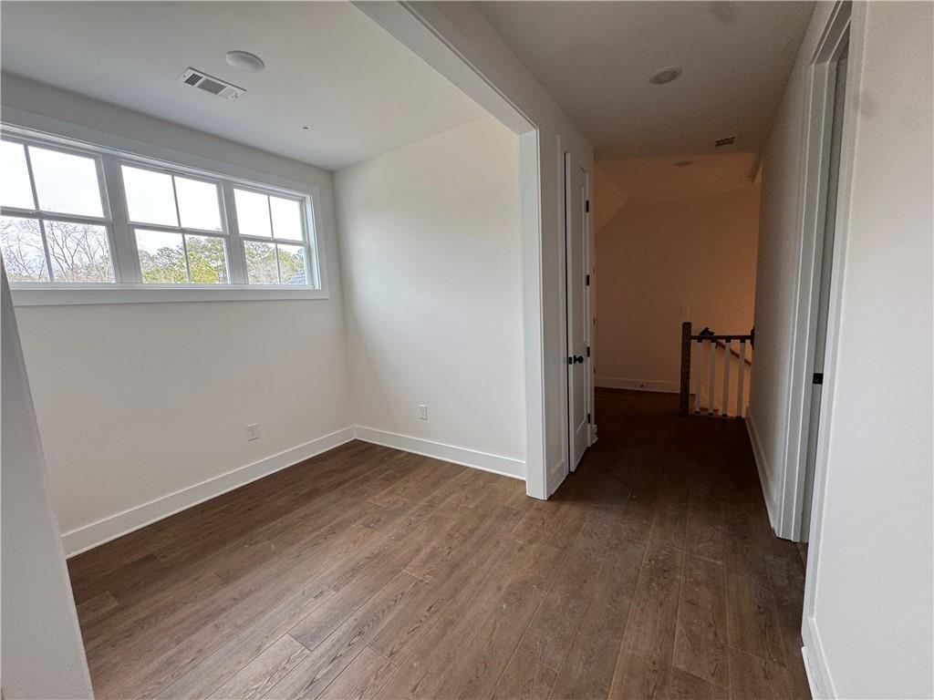1699 Darby Road Waleska, GA 30183 - Photo 12 of 17 an empty room with wooden floor and windows